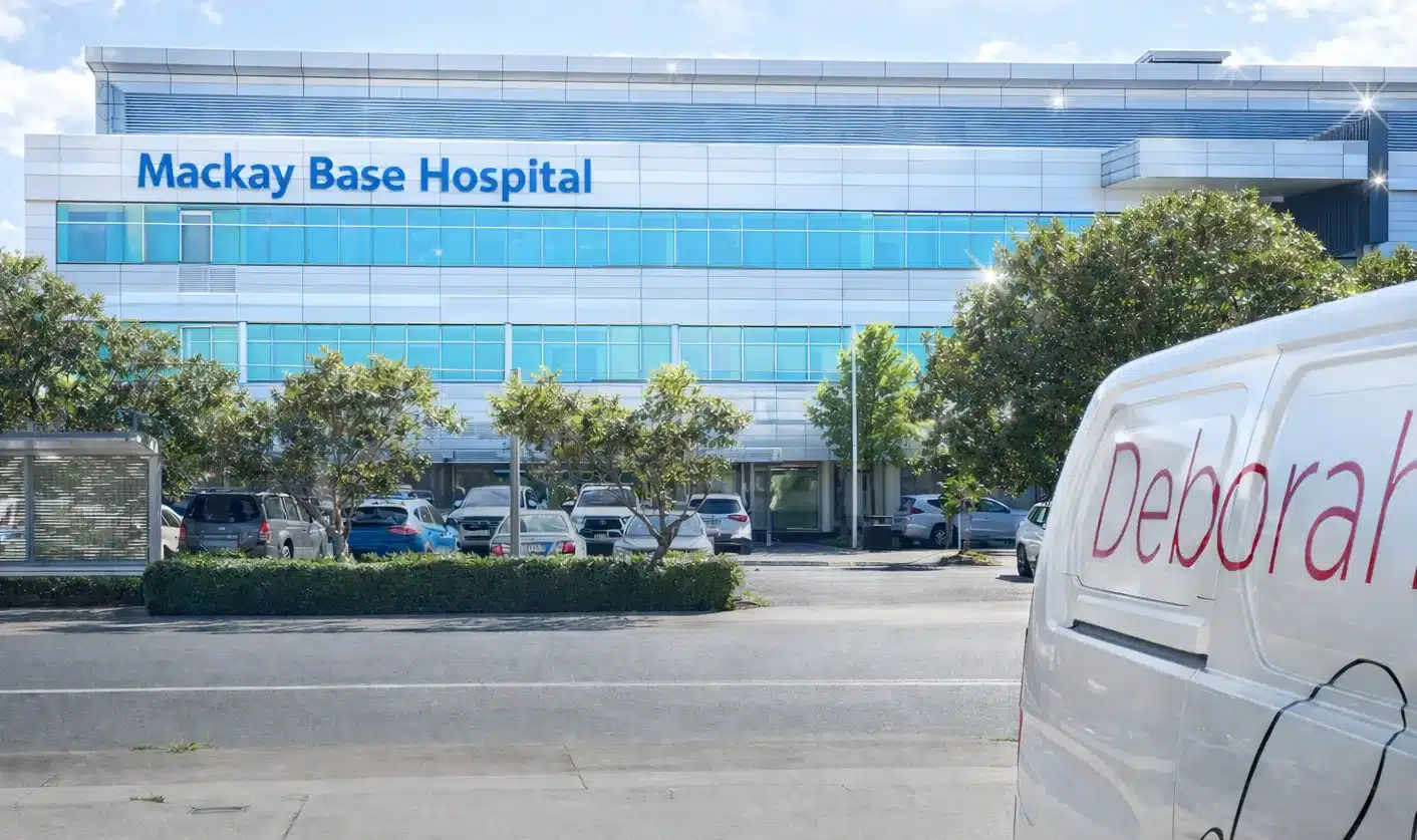 Mackay Base Hospital building with Deborah’s Flowers delivery van parked at their shop location. 