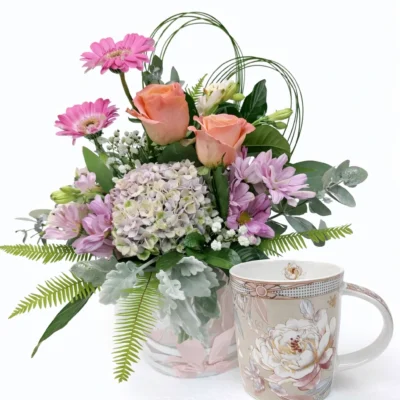 Beautifully sweet bouquet with rose pattern teacup.