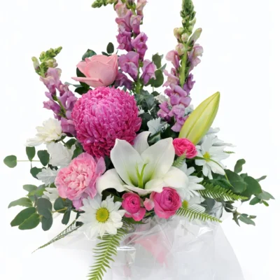 Bright and expansive bouquet with mix of flowers.